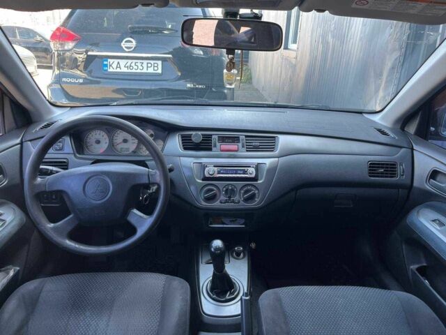 Чорний Міцубісі Lancer, об'ємом двигуна 2 л та пробігом 310 тис. км за 4990 $, фото 12 на Automoto.ua