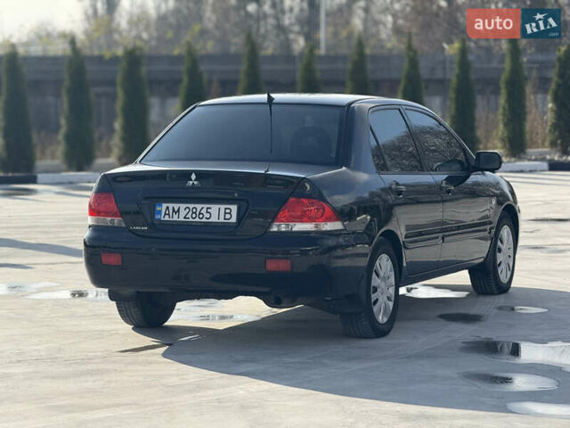 Чорний Міцубісі Lancer, об'ємом двигуна 1.6 л та пробігом 205 тис. км за 3650 $, фото 3 на Automoto.ua