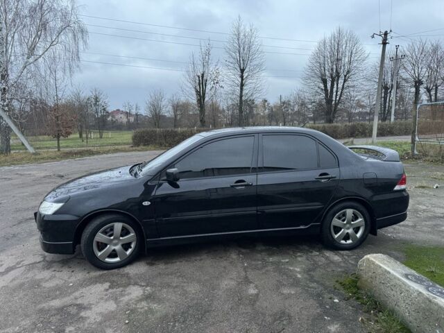 Чорний Міцубісі Lancer, об'ємом двигуна 1.6 л та пробігом 154 тис. км за 5500 $, фото 4 на Automoto.ua