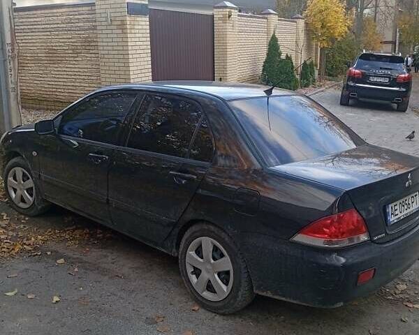 Чорний Міцубісі Lancer, об'ємом двигуна 1.6 л та пробігом 211 тис. км за 3700 $, фото 5 на Automoto.ua