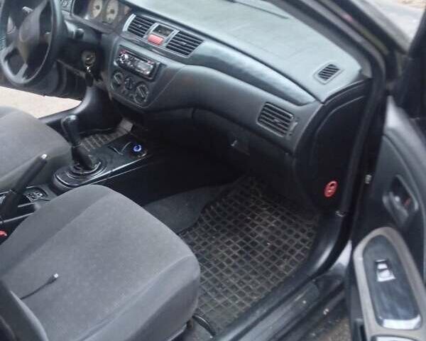 Чорний Міцубісі Lancer, об'ємом двигуна 1.6 л та пробігом 211 тис. км за 3700 $, фото 1 на Automoto.ua