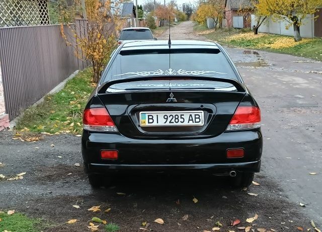 Чорний Міцубісі Lancer, об'ємом двигуна 1.6 л та пробігом 261 тис. км за 4400 $, фото 4 на Automoto.ua