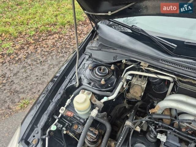 Черный Мицубиси Лансер, объемом двигателя 1.58 л и пробегом 280 тыс. км за 3200 $, фото 16 на Automoto.ua