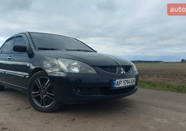 Черный Мицубиси Лансер, объемом двигателя 2 л и пробегом 225 тыс. км за 4400 $, фото 3 на Automoto.ua