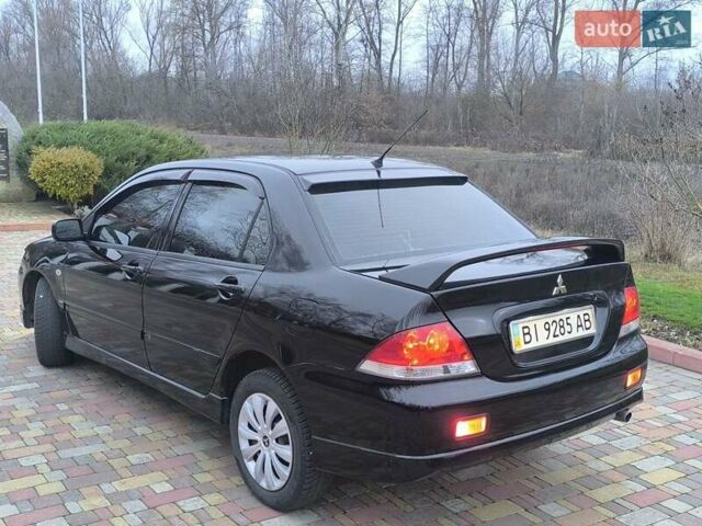 Чорний Міцубісі Lancer, об'ємом двигуна 1.58 л та пробігом 263 тис. км за 4500 $, фото 16 на Automoto.ua