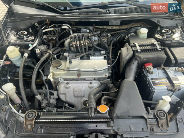 Чорний Міцубісі Lancer, об'ємом двигуна 1.58 л та пробігом 364 тис. км за 4000 $, фото 14 на Automoto.ua
