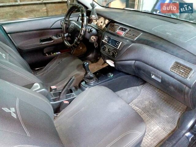 Чорний Міцубісі Lancer, об'ємом двигуна 1.58 л та пробігом 294 тис. км за 3800 $, фото 5 на Automoto.ua