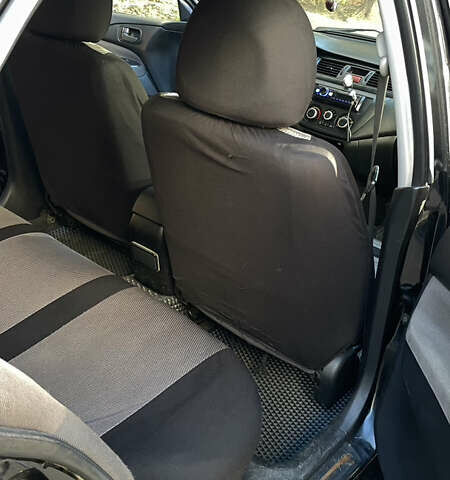 Черный Мицубиси Лансер, объемом двигателя 1.6 л и пробегом 200 тыс. км за 3000 $, фото 7 на Automoto.ua