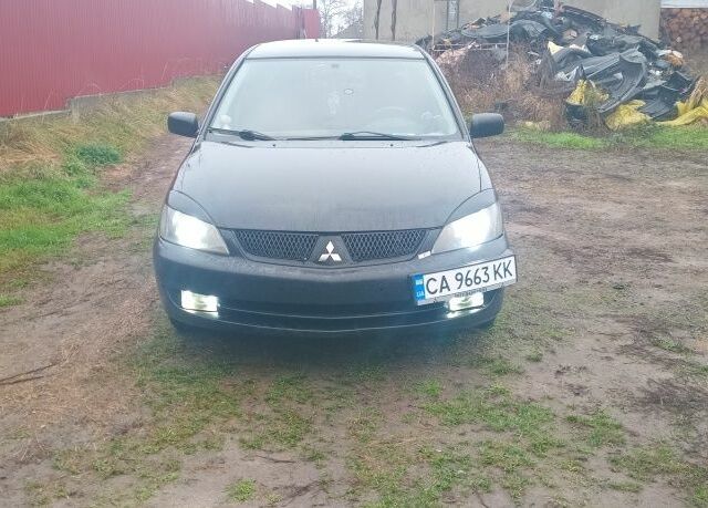 Черный Мицубиси Лансер, объемом двигателя 2 л и пробегом 270 тыс. км за 3200 $, фото 2 на Automoto.ua