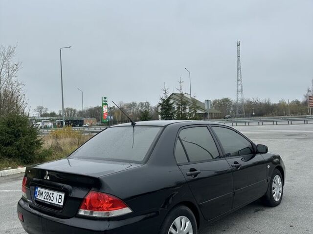 Черный Мицубиси Лансер, объемом двигателя 1.6 л и пробегом 200 тыс. км за 3500 $, фото 6 на Automoto.ua