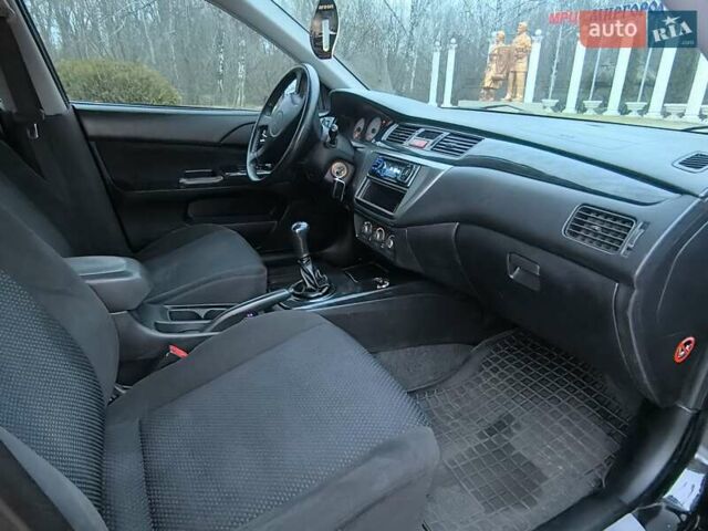 Чорний Міцубісі Lancer, об'ємом двигуна 1.58 л та пробігом 263 тис. км за 4500 $, фото 10 на Automoto.ua