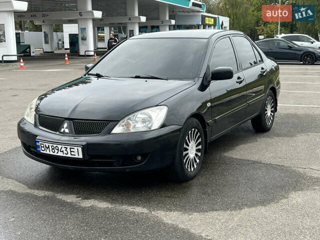 Черный Мицубиси Лансер, объемом двигателя 1.58 л и пробегом 300 тыс. км за 3850 $, фото 3 на Automoto.ua