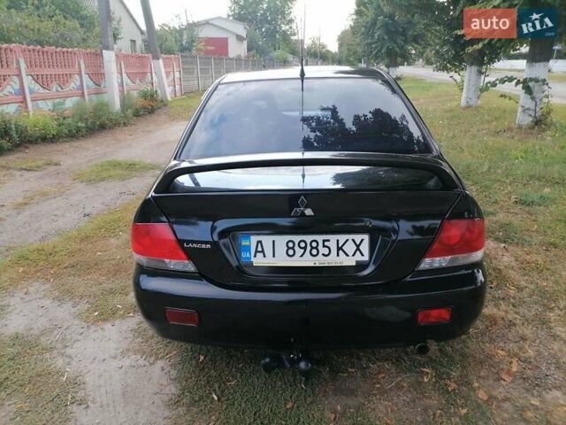 Чорний Міцубісі Lancer, об'ємом двигуна 1.58 л та пробігом 210 тис. км за 2999 $, фото 17 на Automoto.ua