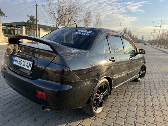Чорний Міцубісі Lancer, об'ємом двигуна 2 л та пробігом 261 тис. км за 2700 $, фото 11 на Automoto.ua