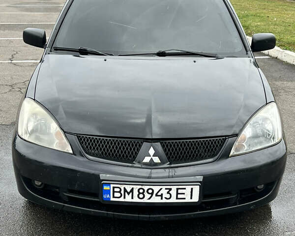 Черный Мицубиси Лансер, объемом двигателя 1.58 л и пробегом 300 тыс. км за 3850 $, фото 2 на Automoto.ua
