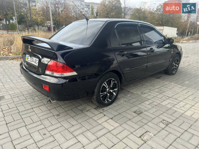 Чорний Міцубісі Lancer, об'ємом двигуна 1.58 л та пробігом 364 тис. км за 4000 $, фото 7 на Automoto.ua