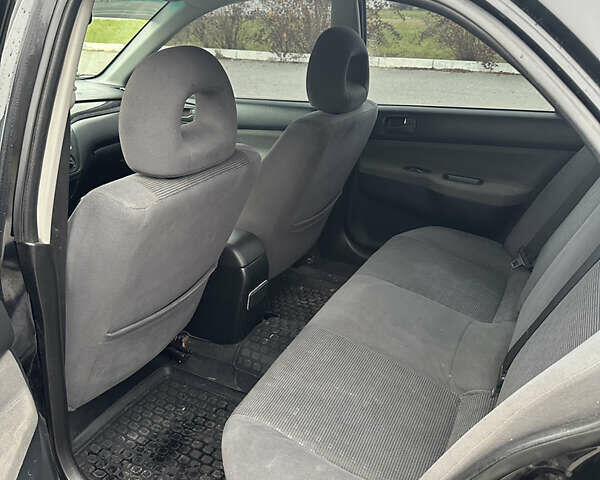 Черный Мицубиси Лансер, объемом двигателя 1.6 л и пробегом 200 тыс. км за 3499 $, фото 10 на Automoto.ua