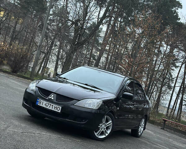 Чорний Міцубісі Lancer, об'ємом двигуна 2 л та пробігом 250 тис. км за 3999 $, фото 3 на Automoto.ua