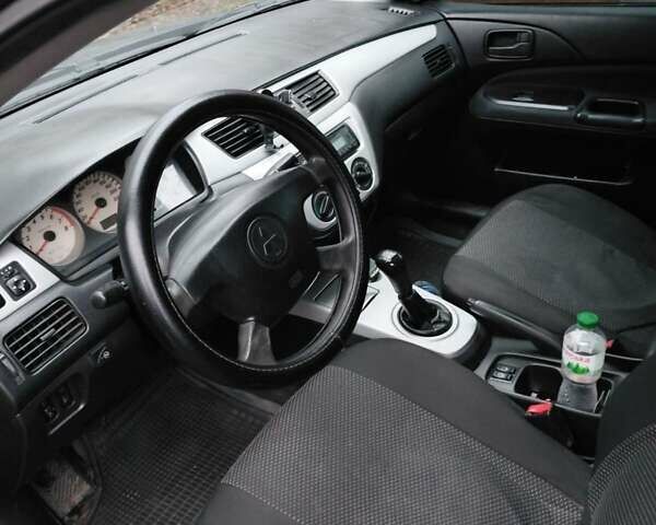 Черный Мицубиси Лансер, объемом двигателя 1.58 л и пробегом 238 тыс. км за 3500 $, фото 5 на Automoto.ua