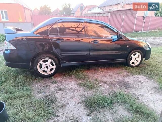 Чорний Міцубісі Lancer, об'ємом двигуна 1.58 л та пробігом 294 тис. км за 3800 $, фото 7 на Automoto.ua
