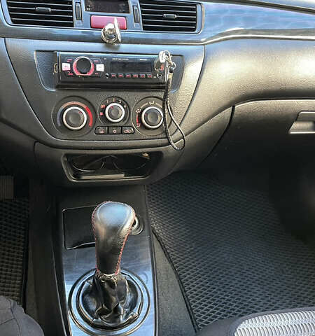 Черный Мицубиси Лансер, объемом двигателя 1.6 л и пробегом 200 тыс. км за 3000 $, фото 10 на Automoto.ua