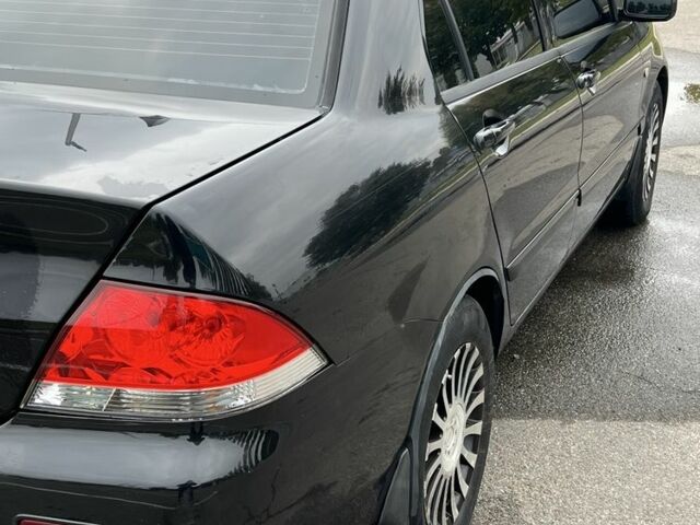 Черный Мицубиси Лансер, объемом двигателя 1.6 л и пробегом 390 тыс. км за 4000 $, фото 5 на Automoto.ua