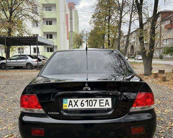Черный Мицубиси Лансер, объемом двигателя 1.58 л и пробегом 341 тыс. км за 3950 $, фото 4 на Automoto.ua