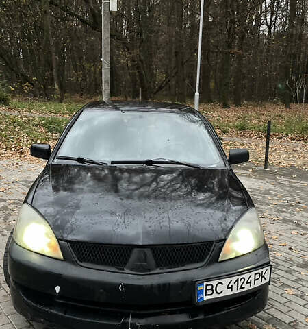 Черный Мицубиси Лансер, объемом двигателя 1.6 л и пробегом 200 тыс. км за 3000 $, фото 2 на Automoto.ua