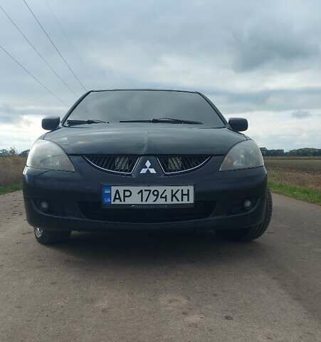 Черный Мицубиси Лансер, объемом двигателя 2 л и пробегом 225 тыс. км за 4400 $, фото 7 на Automoto.ua