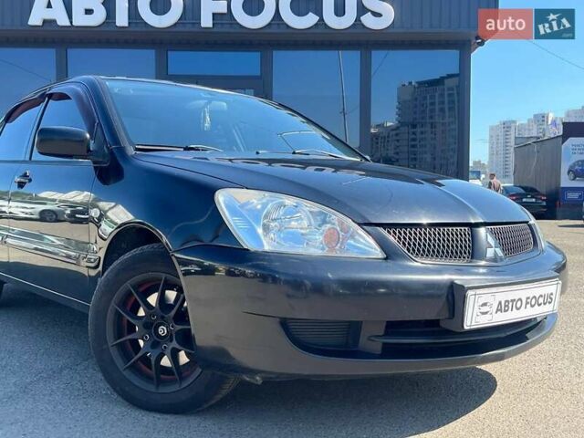 Черный Мицубиси Лансер, объемом двигателя 1.58 л и пробегом 310 тыс. км за 5690 $, фото 1 на Automoto.ua