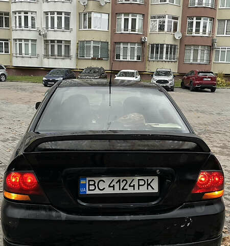 Черный Мицубиси Лансер, объемом двигателя 1.6 л и пробегом 200 тыс. км за 3000 $, фото 4 на Automoto.ua