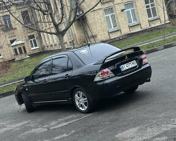 Чорний Міцубісі Lancer, об'ємом двигуна 2 л та пробігом 250 тис. км за 3999 $, фото 4 на Automoto.ua