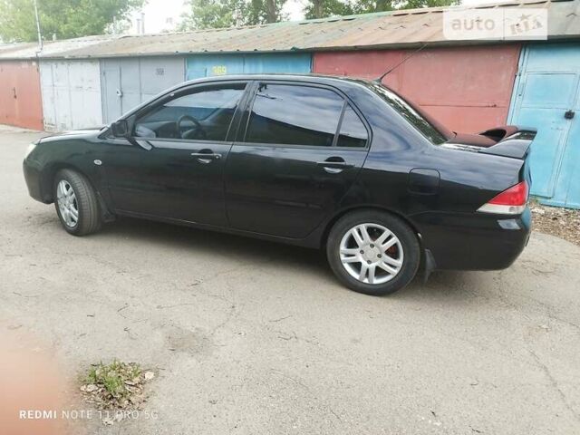 Чорний Міцубісі Lancer, об'ємом двигуна 1.6 л та пробігом 243 тис. км за 3900 $, фото 6 на Automoto.ua