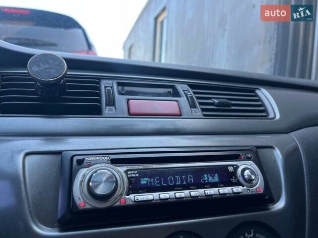 Черный Мицубиси Лансер, объемом двигателя 1.58 л и пробегом 310 тыс. км за 5690 $, фото 21 на Automoto.ua