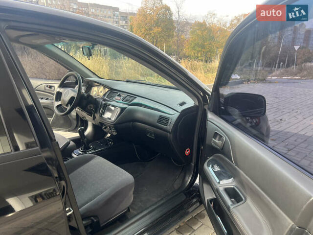 Чорний Міцубісі Lancer, об'ємом двигуна 1.58 л та пробігом 364 тис. км за 4000 $, фото 12 на Automoto.ua