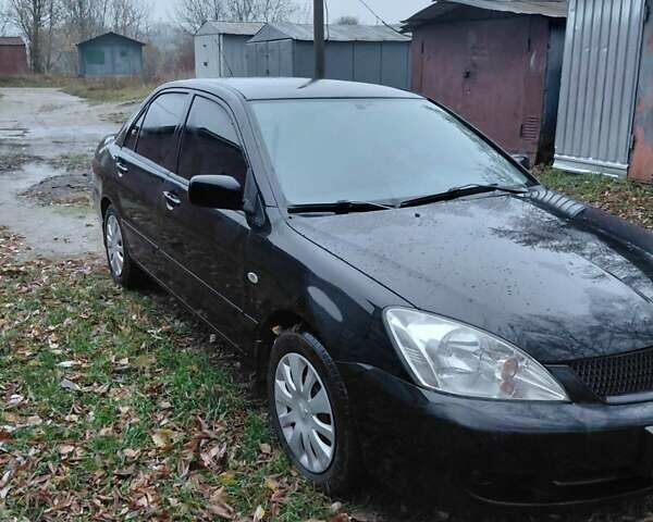 Черный Мицубиси Лансер, объемом двигателя 1.58 л и пробегом 238 тыс. км за 3500 $, фото 6 на Automoto.ua