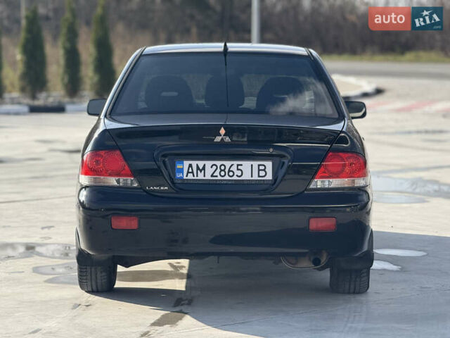 Чорний Міцубісі Lancer, об'ємом двигуна 1.6 л та пробігом 205 тис. км за 3650 $, фото 2 на Automoto.ua