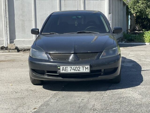 Чорний Міцубісі Lancer, об'ємом двигуна 1.6 л та пробігом 320 тис. км за 3599 $, фото 1 на Automoto.ua