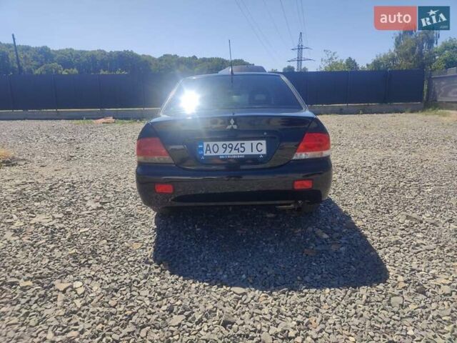 Чорний Міцубісі Lancer, об'ємом двигуна 1.58 л та пробігом 206 тис. км за 3900 $, фото 3 на Automoto.ua