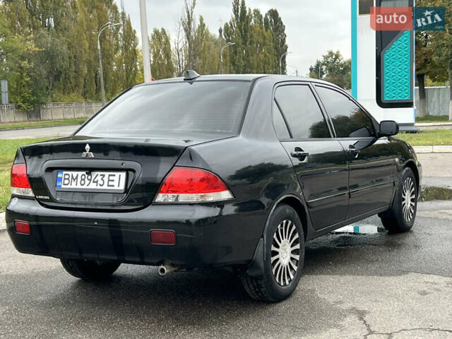 Черный Мицубиси Лансер, объемом двигателя 1.58 л и пробегом 300 тыс. км за 3850 $, фото 6 на Automoto.ua