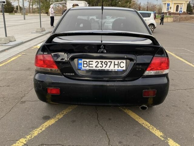 Черный Мицубиси Лансер, объемом двигателя 1.6 л и пробегом 350 тыс. км за 2900 $, фото 5 на Automoto.ua
