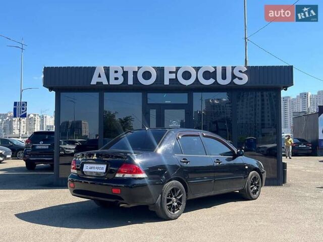 Черный Мицубиси Лансер, объемом двигателя 1.58 л и пробегом 310 тыс. км за 5690 $, фото 7 на Automoto.ua