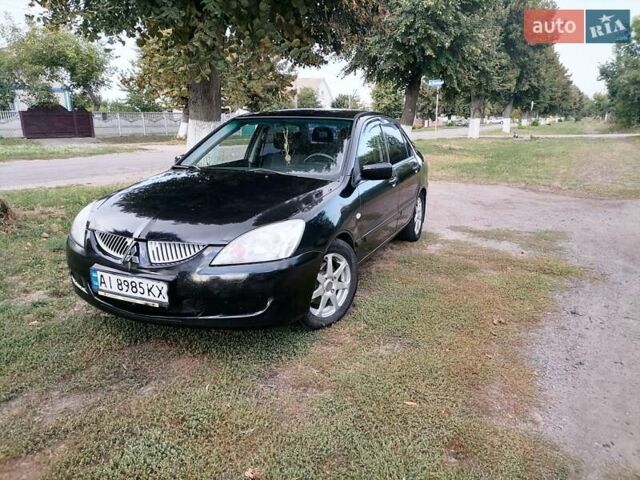 Чорний Міцубісі Lancer, об'ємом двигуна 1.58 л та пробігом 210 тис. км за 2999 $, фото 1 на Automoto.ua
