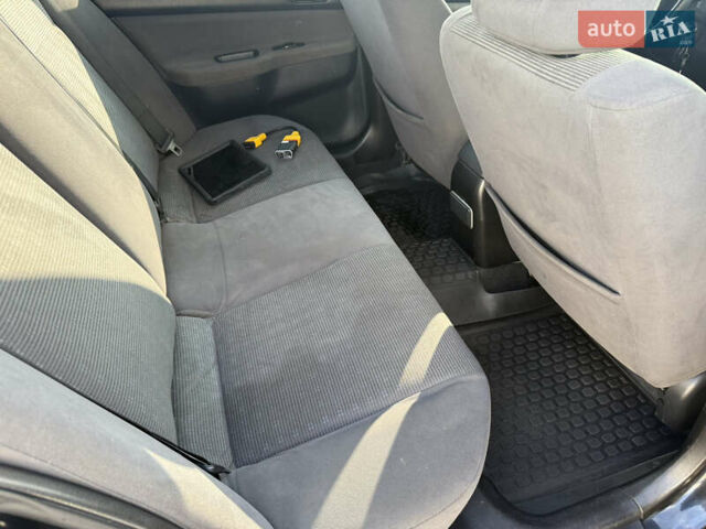 Чорний Міцубісі Lancer, об'ємом двигуна 1.6 л та пробігом 205 тис. км за 3650 $, фото 15 на Automoto.ua