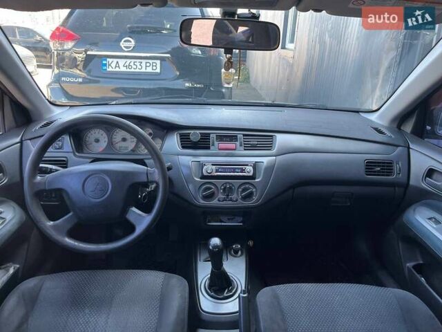 Черный Мицубиси Лансер, объемом двигателя 1.58 л и пробегом 310 тыс. км за 5690 $, фото 12 на Automoto.ua