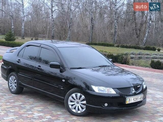Чорний Міцубісі Lancer, об'ємом двигуна 1.58 л та пробігом 263 тис. км за 4500 $, фото 3 на Automoto.ua
