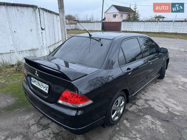 Черный Мицубиси Лансер, объемом двигателя 1.58 л и пробегом 154 тыс. км за 5500 $, фото 9 на Automoto.ua
