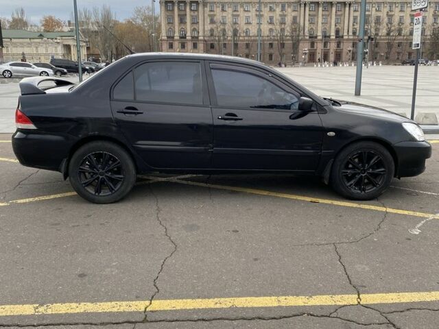 Черный Мицубиси Лансер, объемом двигателя 1.6 л и пробегом 350 тыс. км за 2900 $, фото 4 на Automoto.ua