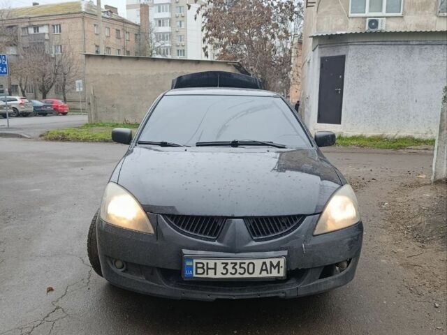 Черный Мицубиси Лансер, объемом двигателя 2 л и пробегом 275 тыс. км за 2599 $, фото 3 на Automoto.ua