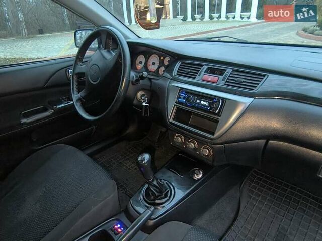 Чорний Міцубісі Lancer, об'ємом двигуна 1.58 л та пробігом 263 тис. км за 4500 $, фото 7 на Automoto.ua